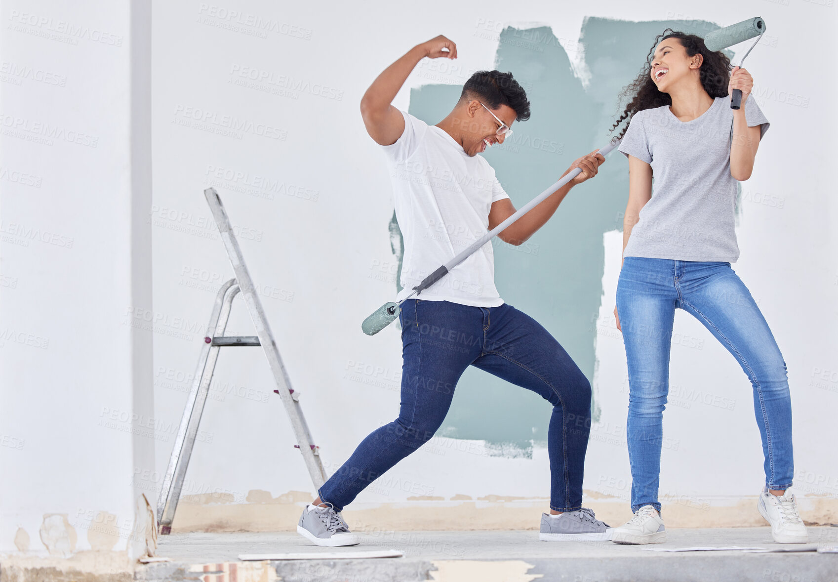 Buy stock photo Happy couple, together or painting home with dancing, teamwork and happiness for apartment upgrade. Man, woman or house with singing for renovation project, creative process with property maintenance