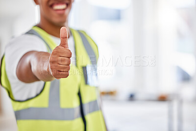 Buy stock photo Cropped shot of an unrecognisable contractor standing alone inside and showing a thumbs up