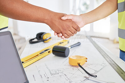 Buy stock photo Handshake, engineering and meeting for cooperation, partnership and celebration with tools in office. Closeup, shaking hands and employees with blueprint, architecture and teamwork for design project