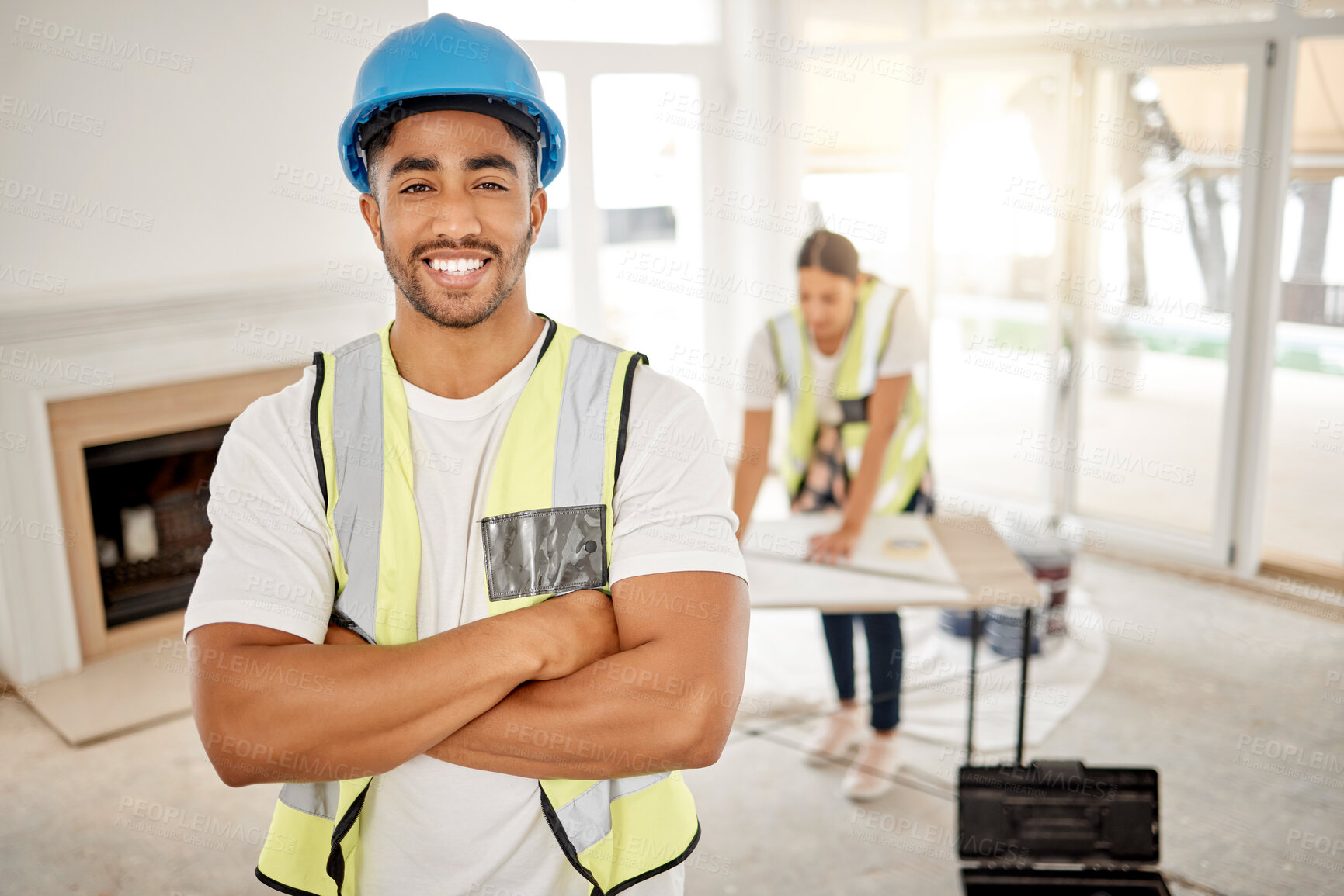 Buy stock photo Portrait of man, construction and home renovation with arms crossed, helmet and smile in apartment. Yes, positive mindset and renovations, happy handyman in safety and building project in new house.