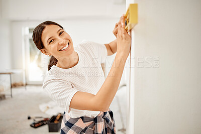 Buy stock photo Portrait, wall and woman with level tool for home building, renovation or maintenance with construction. Happy, designing and female person with measuring equipment for repairs at house or apartment.