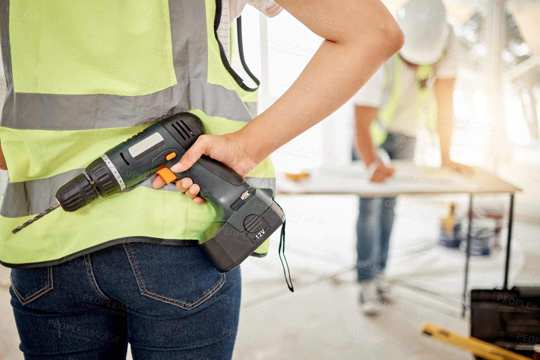Buy stock photo Construction, handyman and drill in hand for maintenance or carpenter work. Back of engineer, constructor or contractor person with electric power tools at building site for home renovation project