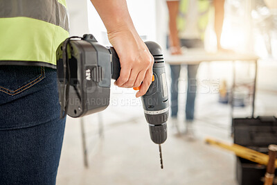 Buy stock photo Drill, construction and hand of handyman for home renovation, maintenance or carpenter work. Back of engineer, constructor or contractor person with electric power tools in room or building site