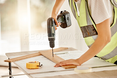 Buy stock photo Carpenter, construction and hand with drill and wood for repair, renovation or building project. Hands of contractor, carpenter or technician person with electric power tools or furniture in workshop