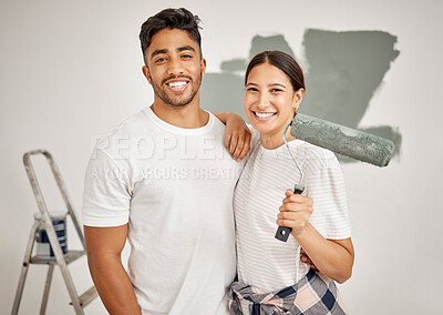 Buy stock photo Shot of a young couple painting a room together