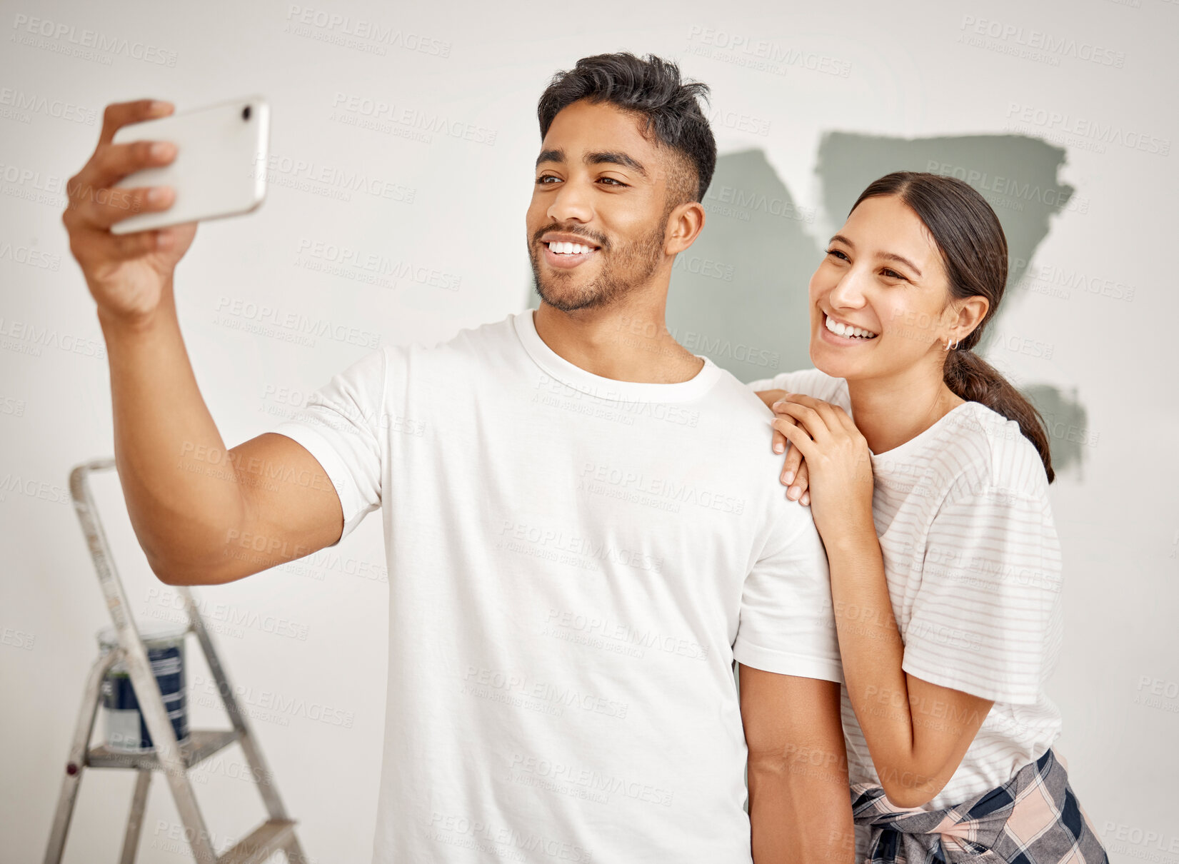 Buy stock photo Happy couple, selfie and painting together for home renovation as partner for house improvement. Woman, man and interior design with photography, apartment and maintenance for decoration on property
