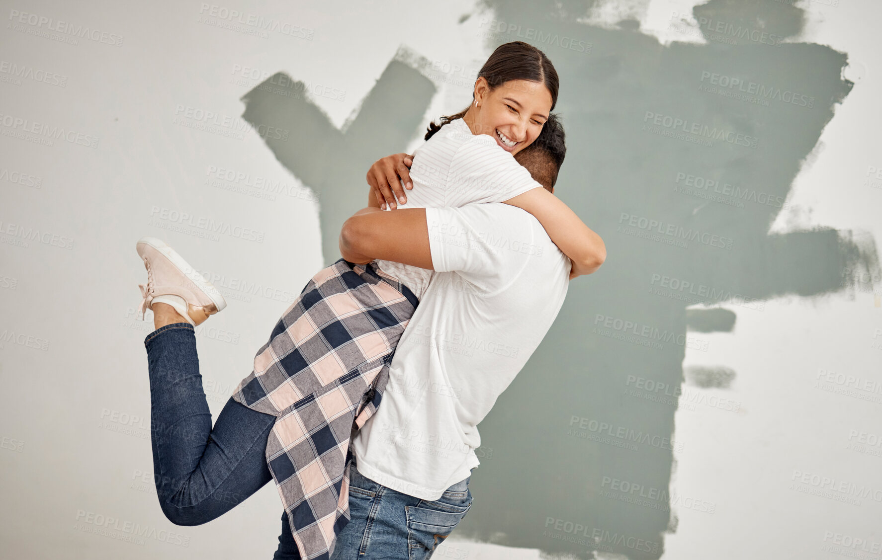 Buy stock photo Happy couple, hug and painting together for home renovation as partner for house improvement. Woman, man and interior design with embrace, apartment and maintenance for decoration on property
