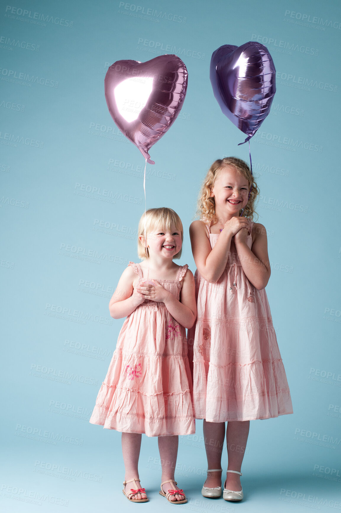 Buy stock photo Children, portrait and sister with heart balloon in studio on blue background for family or party. Birthday, celebration or smile with girl kid friends, happy on color backdrop together for event