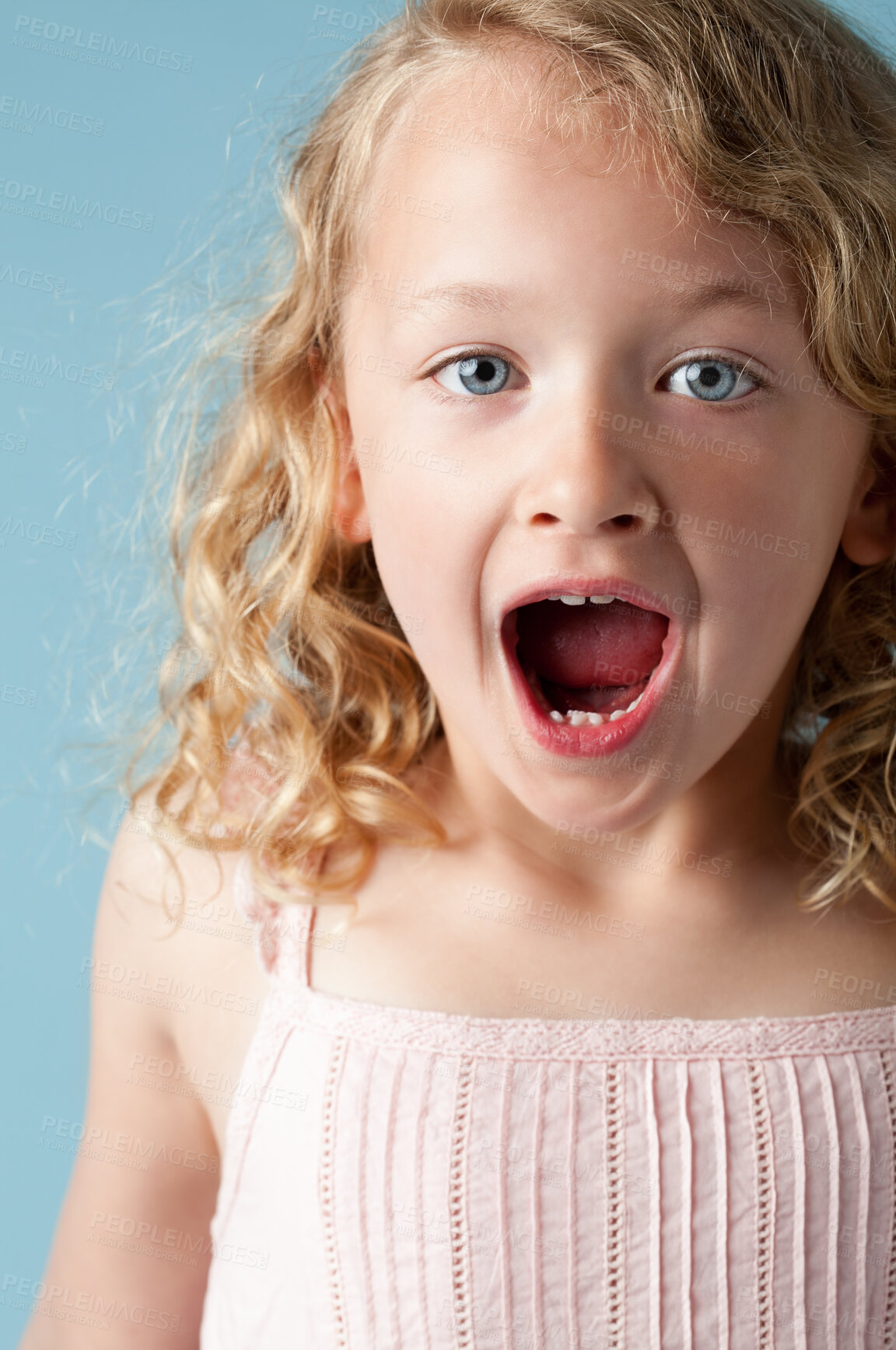 Buy stock photo Studio, child or girl in portrait with surprise, expression and isolated on blue background. Model, backdrop and kid for announcement with face reaction of wow, omg and shocked emoji with mind blown