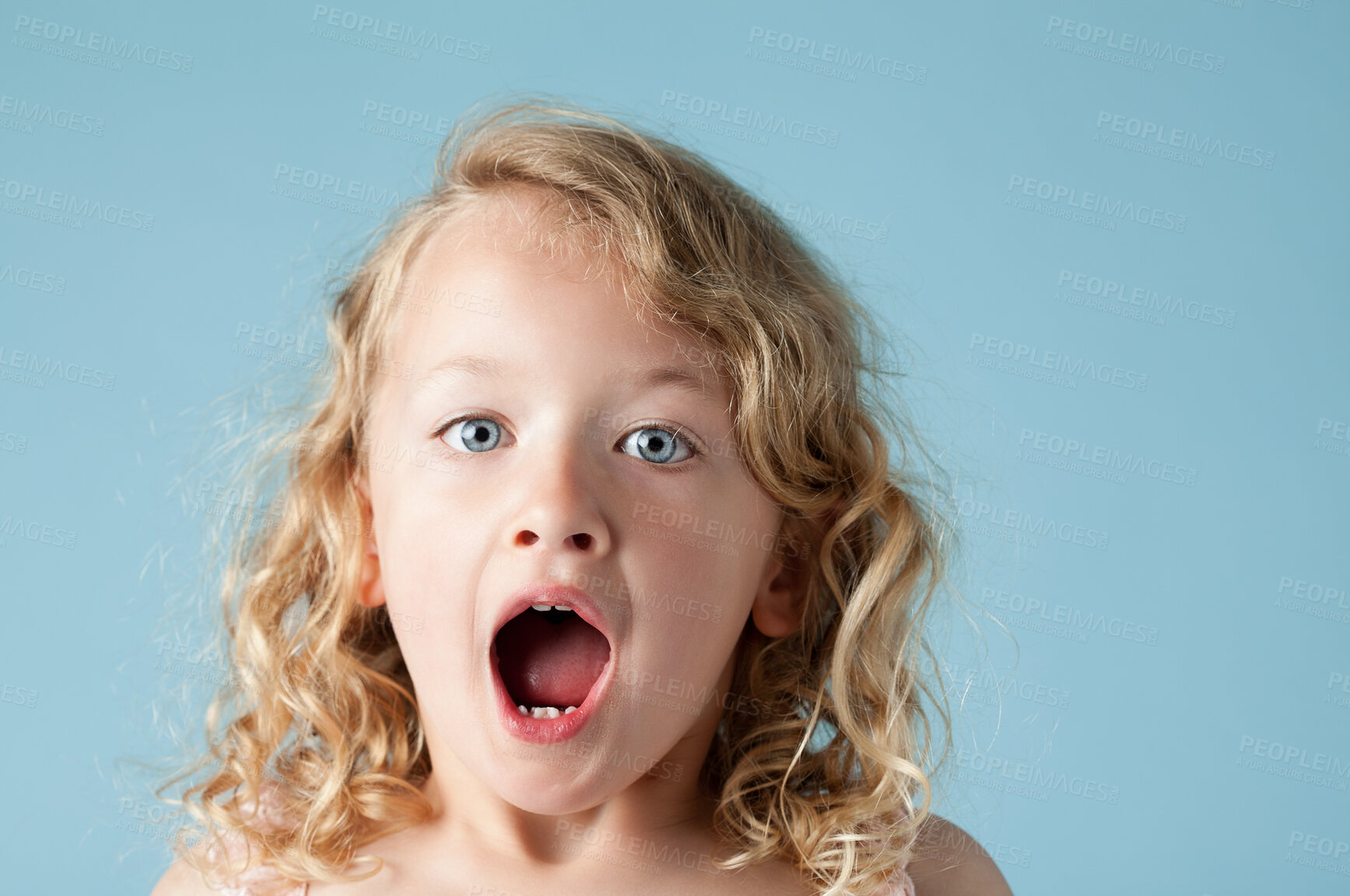 Buy stock photo Studio, child or girl in portrait with shock, expression and isolated on blue background. Model, backdrop and kid for announcement with face reaction of wow, omg and surprised emoji with mind blown