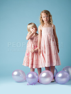 Buy stock photo Kids, sisters and studio with balloons for fashion or development, laugh or thinking with clothes. Children, girls and inflatable on backdrop with style for youth, happy in London or England with fun