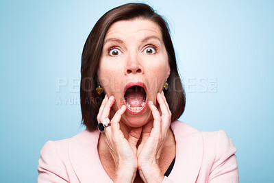 Buy stock photo Portrait, wow and surprise of shocked woman with horror, fear or scared in studio isolated on blue background. Face, omg and wtf announcement of model with secret, news or emoji expression for gossip