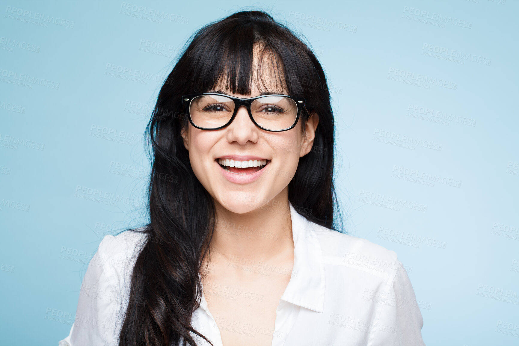 Buy stock photo Happy, optometrist and portrait of woman with glasses in studio, blue background and mockup space. Girl, vision and optician smile for eye care in optometry eyewear, spectacles and fashion frames 