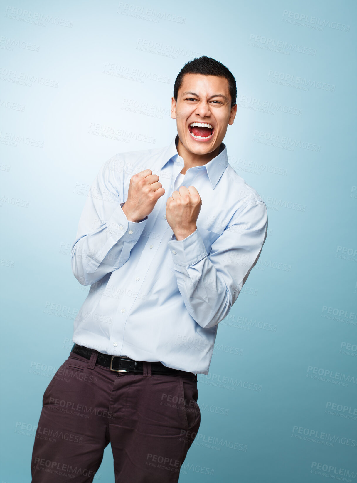 Buy stock photo Portrait, celebration and man with surprise, excited and expression on blue studio background. Face, person and model with shock, achievement or wow with promotion, bonus or omg with smile and winner