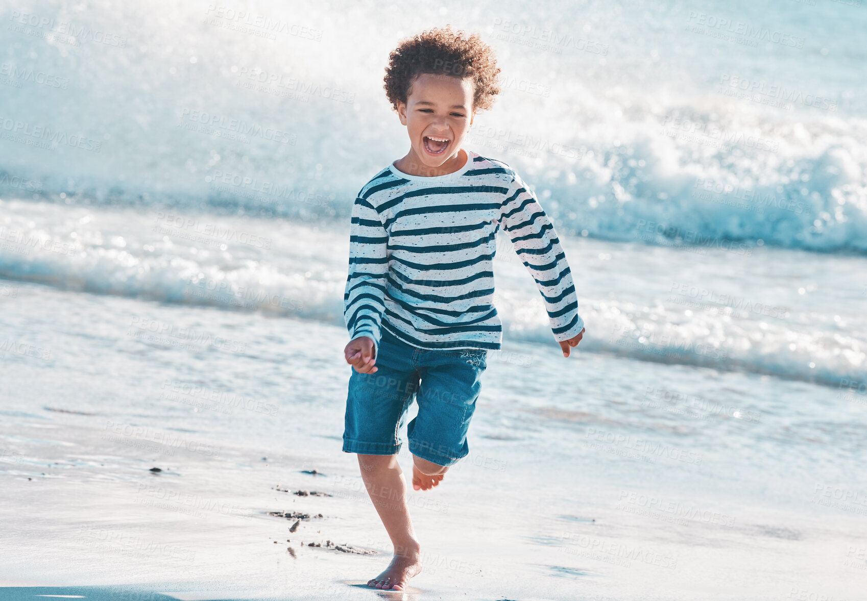 Buy stock photo Excited, child and running from water at beach with energy, ocean waves and fun game for tropical vacation of cardio. Boy, screaming and fitness for nature travel, sea sand and jogging of outdoor 