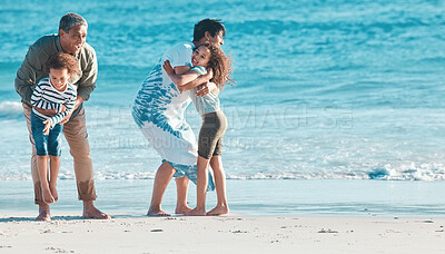 Buy stock photo Shot of a senior couple at the beach with their two grandchildren