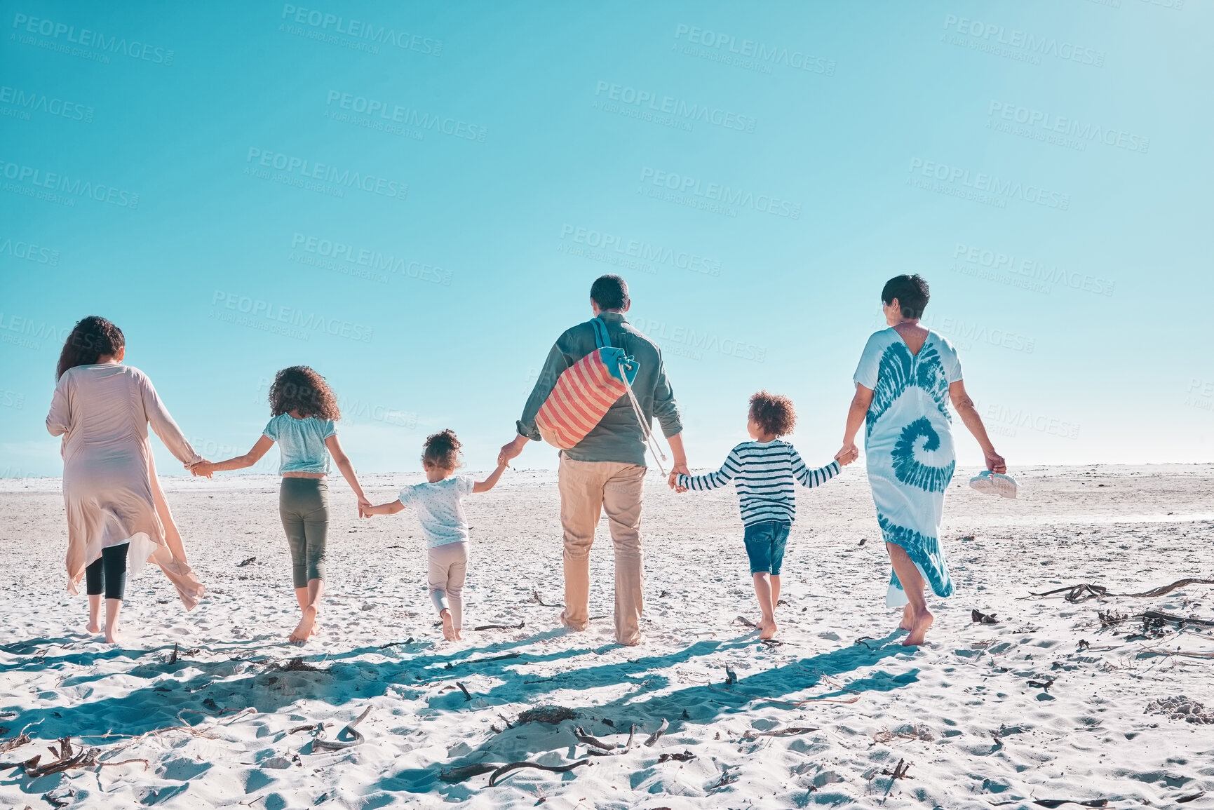 Buy stock photo Walking, parents or children with holding hands at beach for travel, holiday or summer vacation with bonding. Back, family or mockup space at ocean with support, relax and adventure with love or care