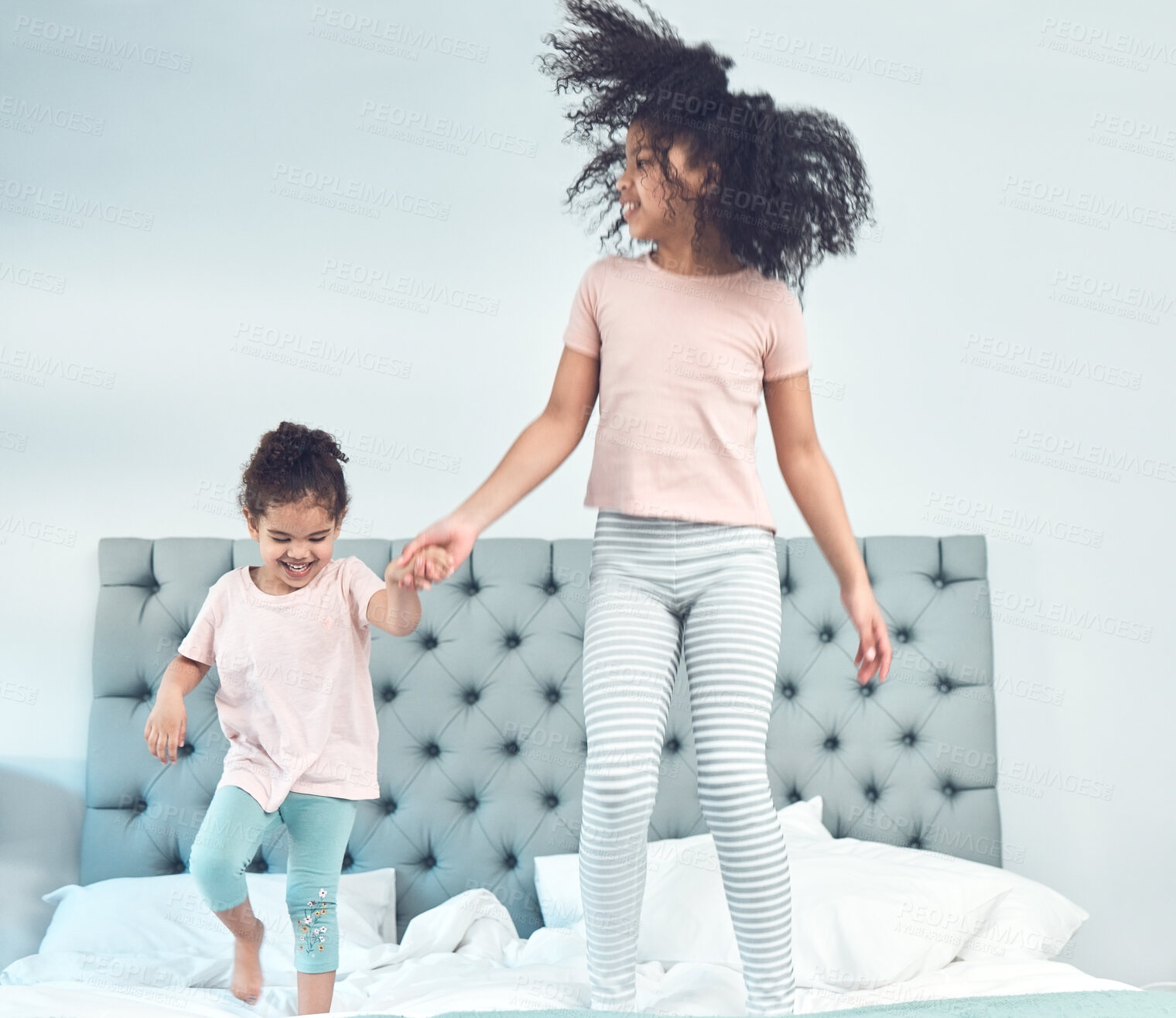 Buy stock photo Happy family, siblings and jumping in bedroom with children, bonding and having fun on weekend in home. People, excited and kids for joy, connection and together as sisters as playful or cheerful