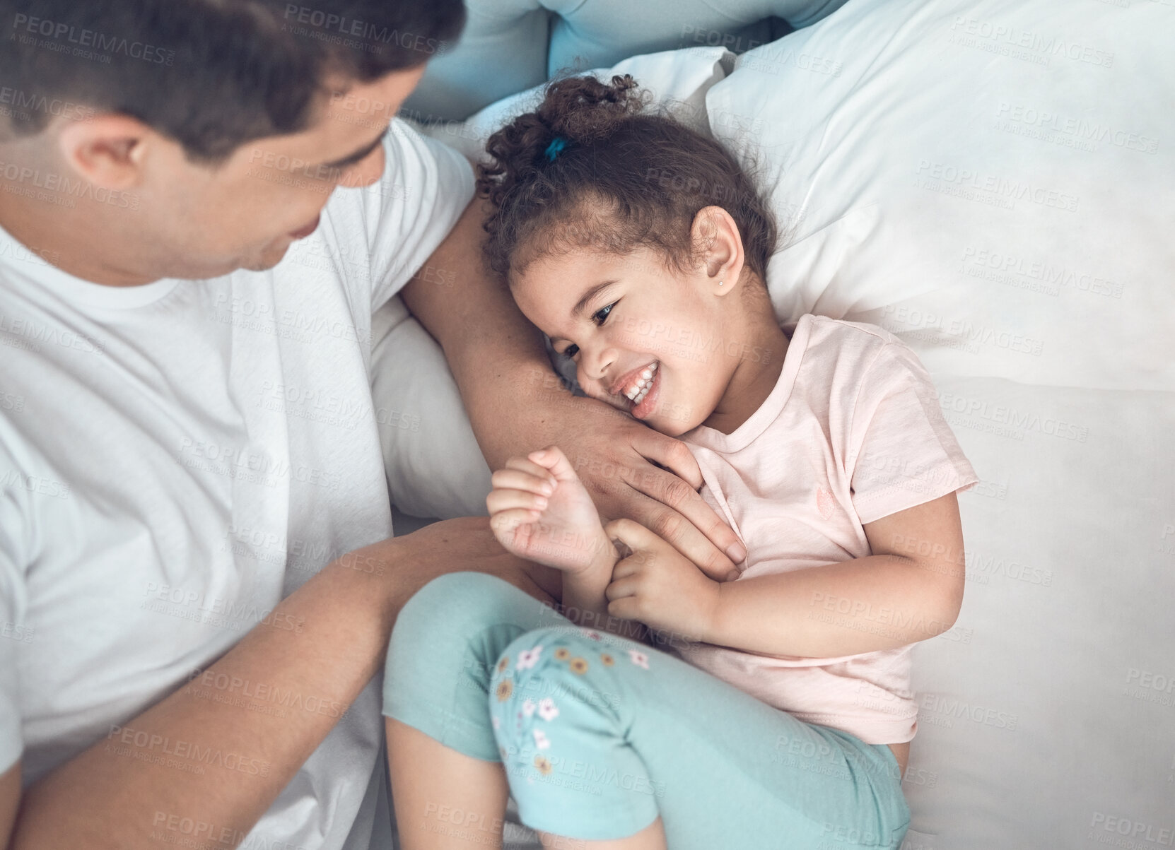 Buy stock photo Tickle, man and child in bedroom, connection and bonding as family, together and funny in home. Father, daughter and affection with love, support and happy for trust, comfort and joy in apartment