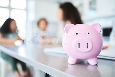 Buy stock photo Shot of an unrecognizable woman teaching her kids about savings