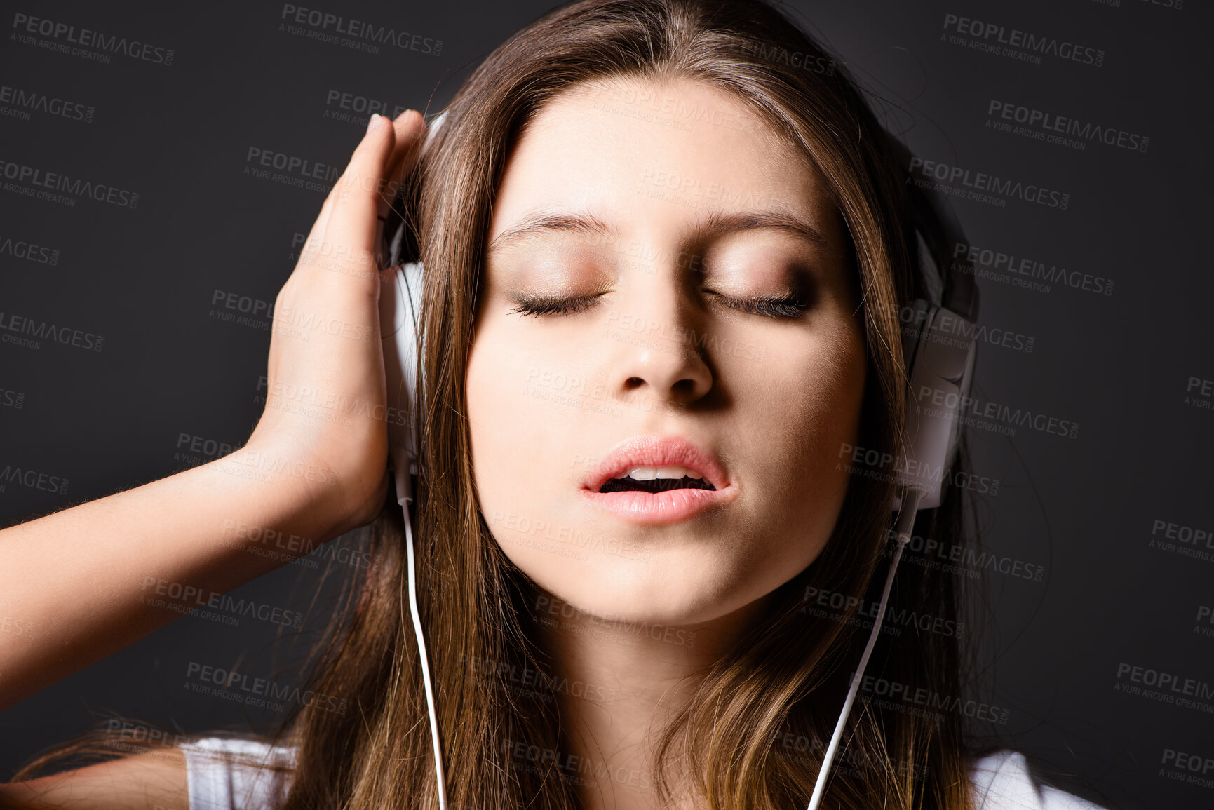 Buy stock photo Studio background, woman and headphones for music to listen with peaceful audio, radio app or online playlist. Girl, gen z and tech for sound track with podcast, streaming song and media subscription