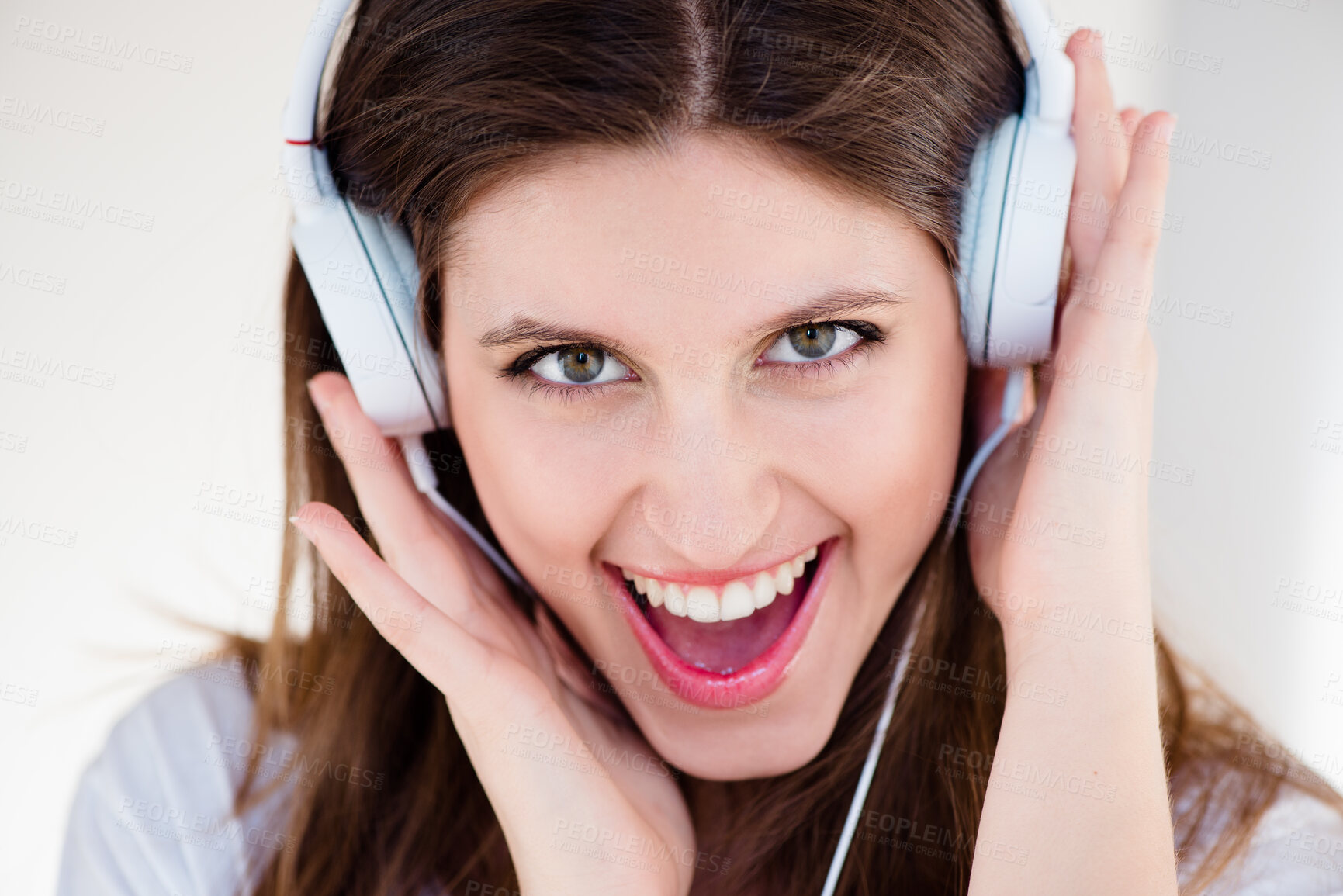 Buy stock photo Portrait, headphones and excited woman listening to music, sound or song isolated on white studio background. Face, singing and happy girl streaming radio, audio or kpop podcast technology to relax