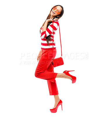 Buy stock photo Shot of a young woman posing against a studio background