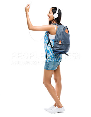 Buy stock photo Selfie, student or woman with headphones on in studio white background for social media post and music stream. Female person, headsets and technology for online communication and internet news