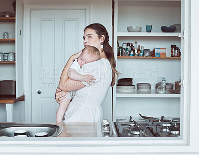 Buy stock photo Shot of a beautiful young mother bonding with her newborn at home