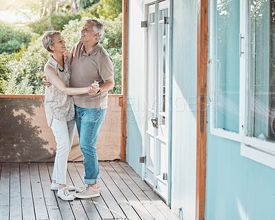 Buy stock photo Shot of a mature couple sharing a dance outside