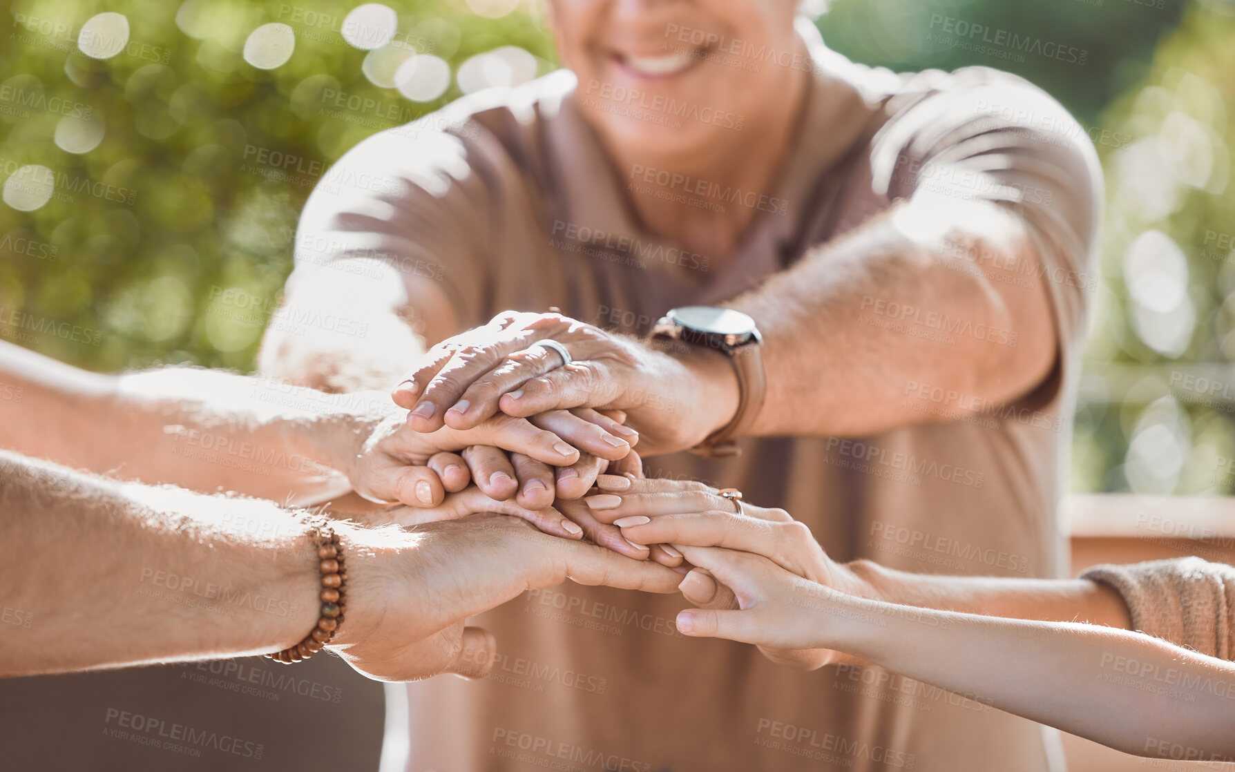 Buy stock photo Family, hands and stack outdoor for support, solidarity and bonding together with team building. People, community and huddle outside for teamwork, collaboration and connection with group circle