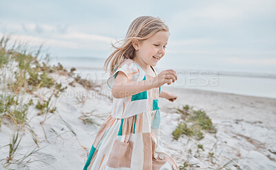 Buy stock photo Shot of an adorable little girl running on the beach
