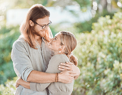 Buy stock photo Couple, hug and smile for love in garden with care, bonding and outdoor in spring for connection. People, man and woman with embrace, together or happy in backyard for eye contact by trees in Croatia