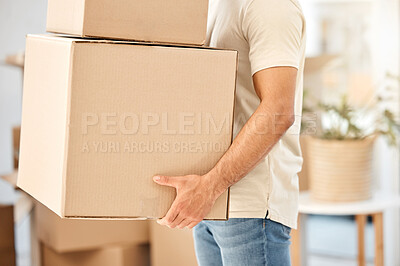Buy stock photo Closeup shot of an unrecognisable man carrying boxes while moving house