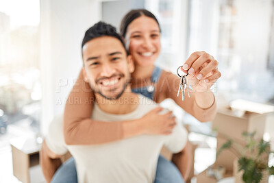 Buy stock photo Closeup shot of a young couple holding the keys to their new house