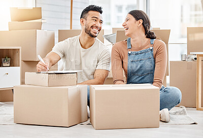 Buy stock photo Shot of a young couple sitting on the floor while moving house