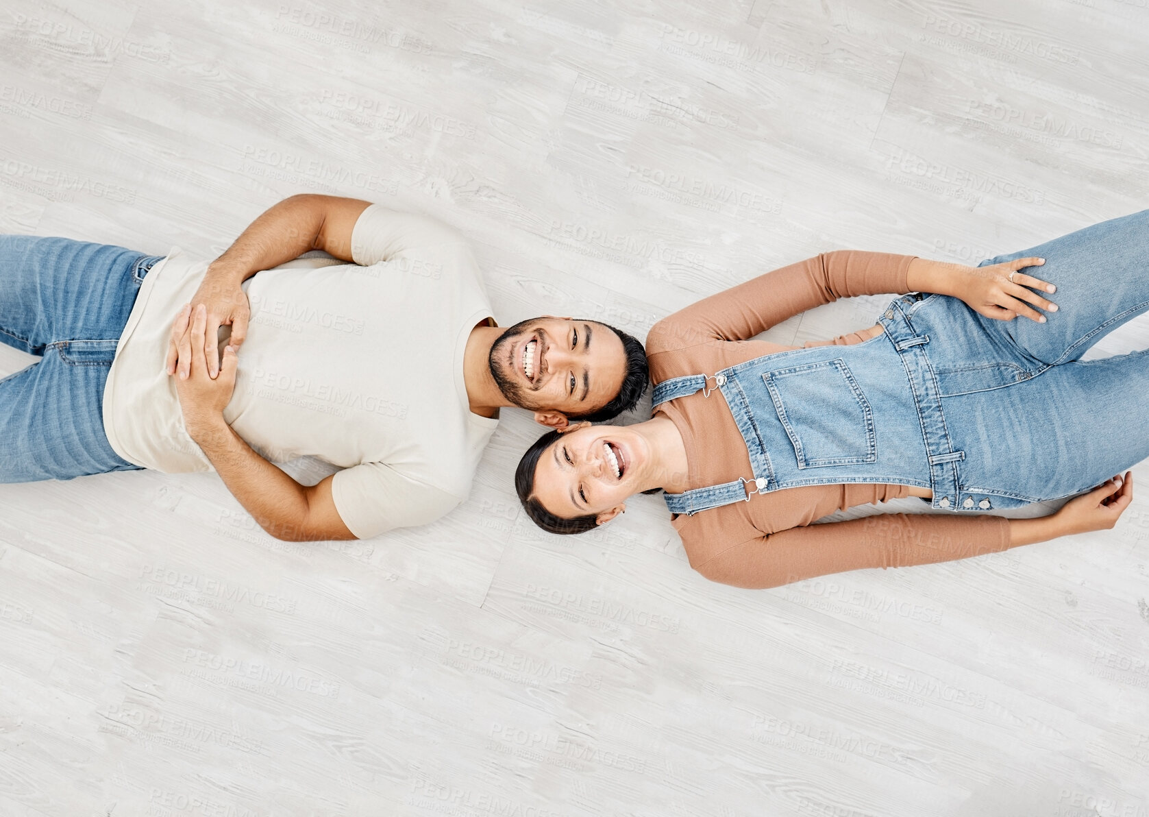 Buy stock photo Love, portrait and smile with couple on wooden floor of new home together for bonding or renovation. Above, happy or relax with man and woman in apartment for decoration, investment or maintenance