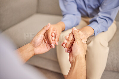 Buy stock photo Home, couple and holding hands for empathy, forgive and confession on couch in living room. Married people, wife and cheating husband for sorry, regret and request for second chance on sofa in house