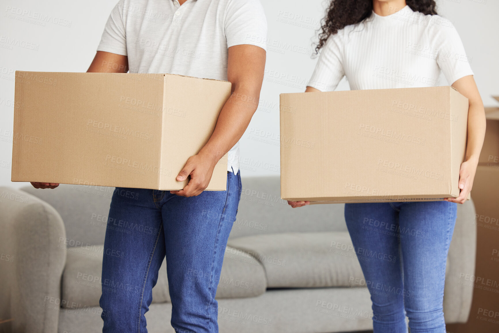 Buy stock photo Hands, people and moving with boxes in home, teamwork for change in rent with real estate. Couple, packing and collaboration in property with mortgage loan, investment in house for future growth