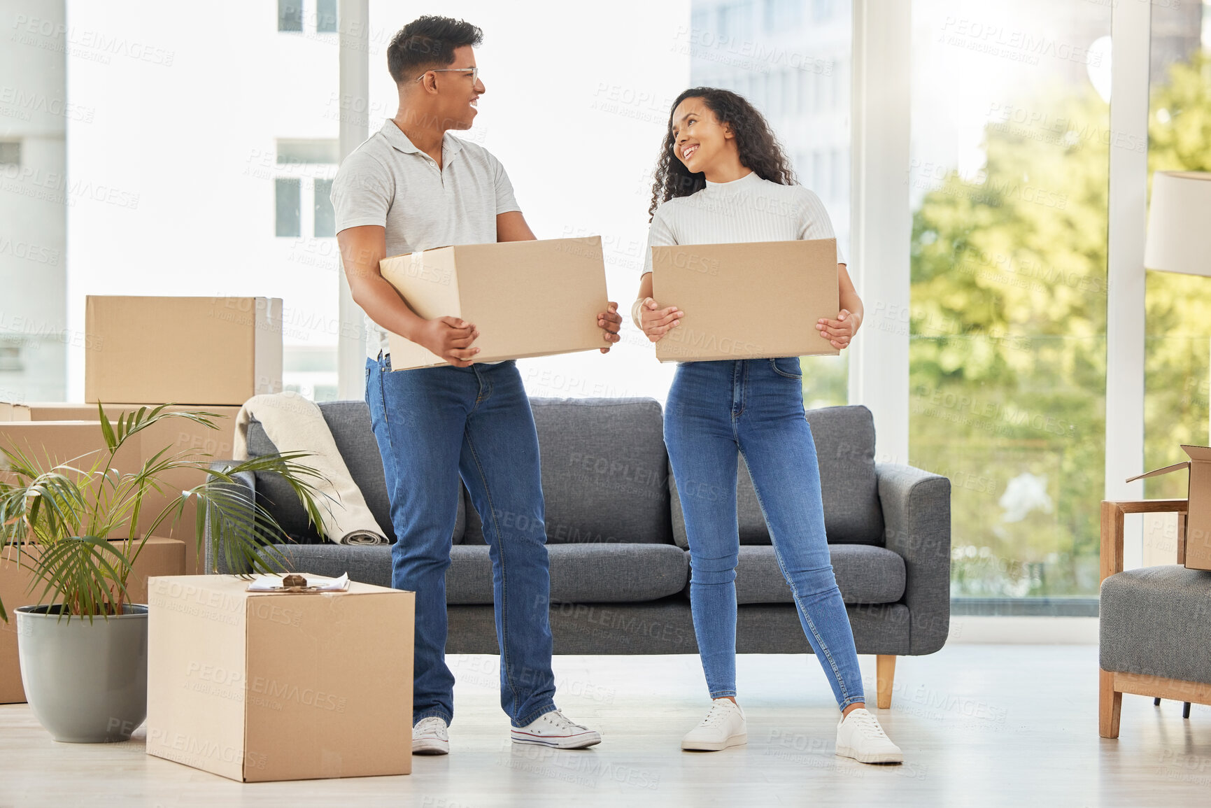 Buy stock photo Couple, together and moving with boxes in house, teamwork for change in rent with real estate. Man, woman and packing for collaboration in property with mortgage, investment in home for future growth