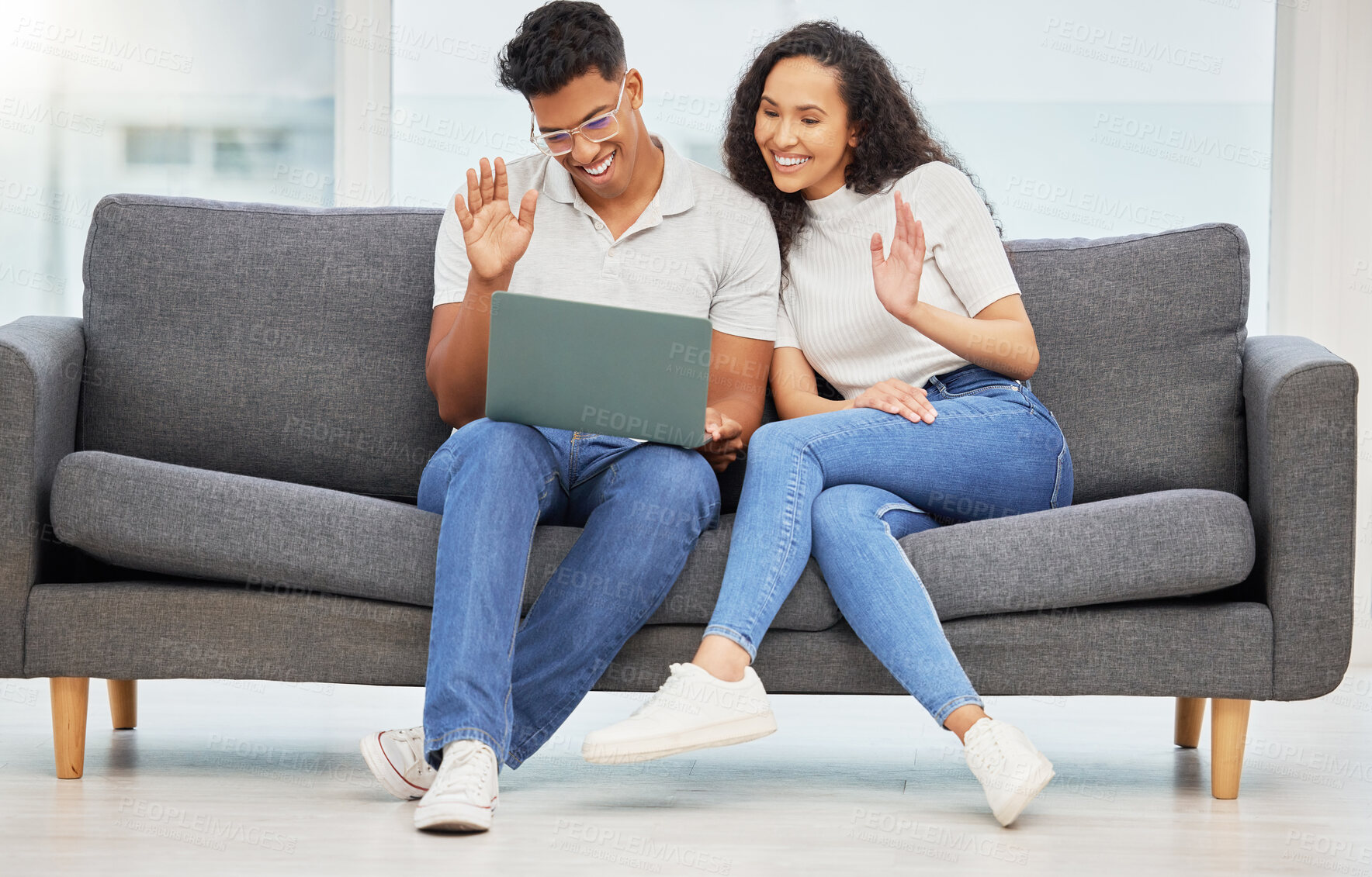 Buy stock photo Couple, wave and video call with laptop on sofa for communication, digital chat or hello in living room. Online, smile and people with hand gesture for virtual conversation, talk or greeting in home