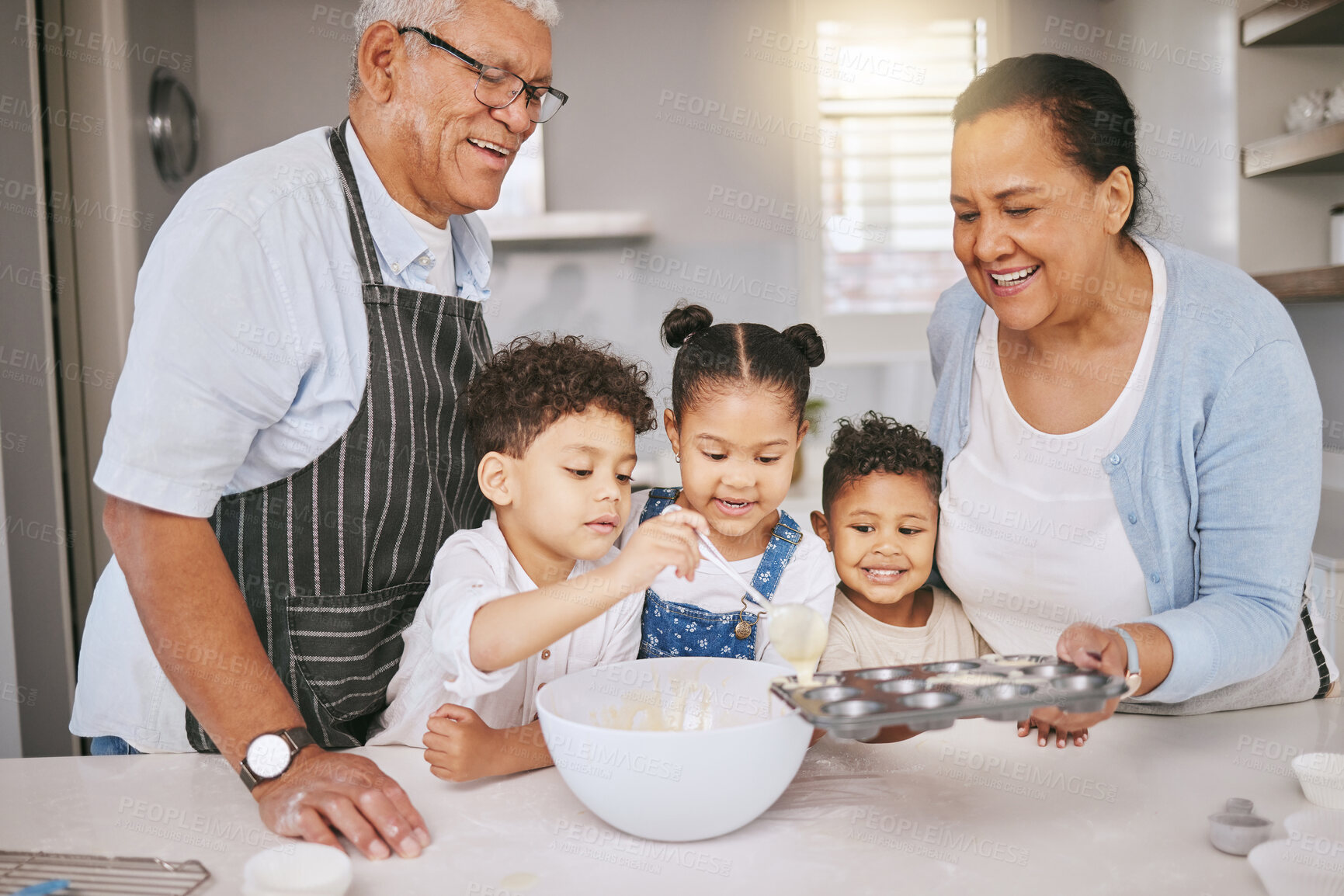 Buy stock photo Baking, ingredients and children with grandparents in kitchen for learning, development or growth. Happy, home and senior man and woman teaching kids to prepare cake, cookies or dessert for bonding.