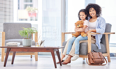 Buy stock photo Shot of a mother and daughter waiting at the doctors office