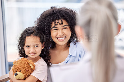 Buy stock photo Shot of a doctor having a consultation with a little girl in a clinic