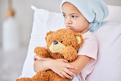 Buy stock photo Shot of a little girl laying in bed at a hospital