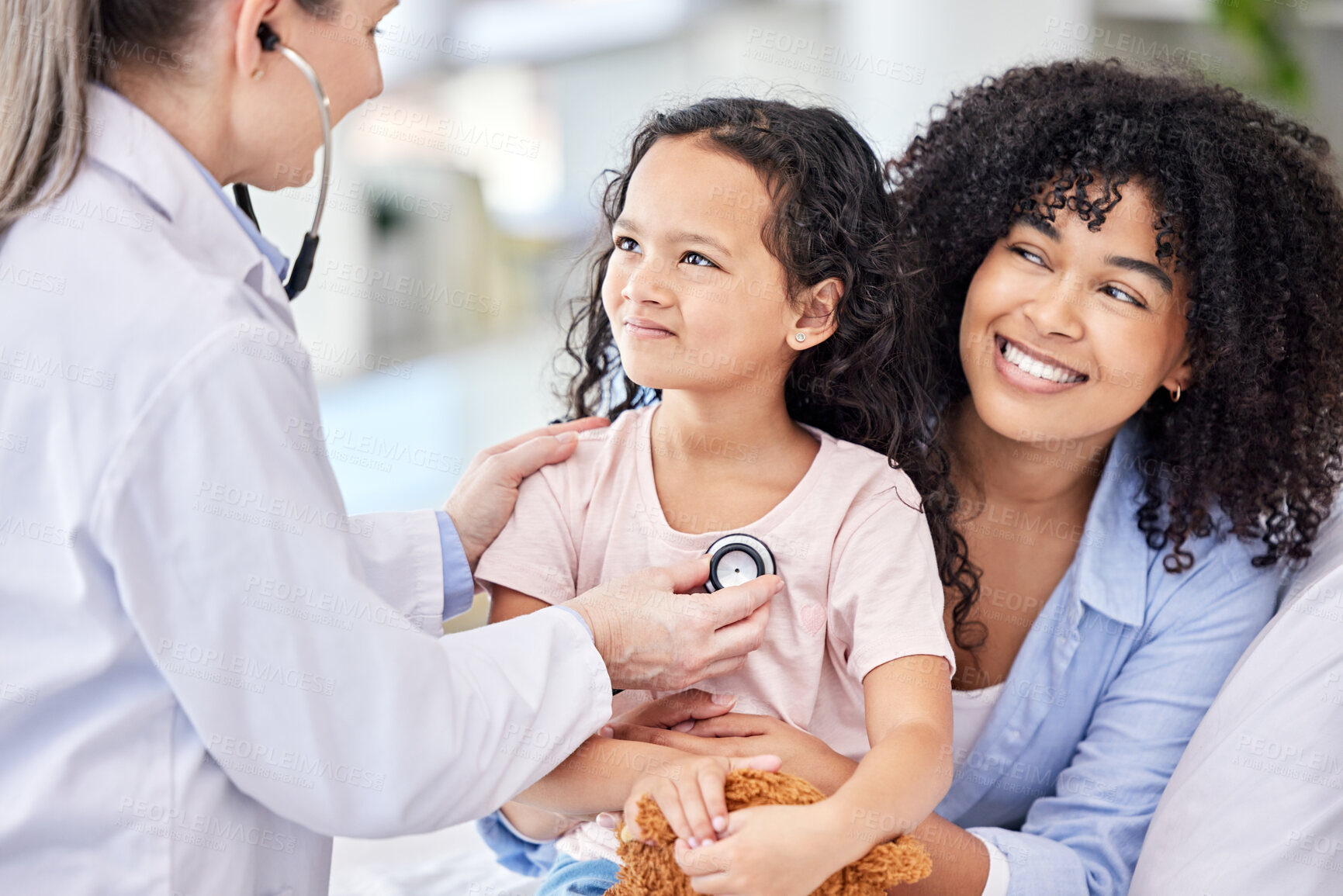 Buy stock photo Young girl, doctor and mother with stethoscope, hospital or clinic for health, medical and screening test. Pediatrician, child and heart beat in routine check up for growth, development and vaccine