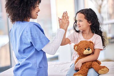 Buy stock photo High five, nurse and child on bed in hospital for children, health and support in medical treatment. Pediatrics, healthcare and kid, nursing caregiver touching hands with young patient and teddy bear