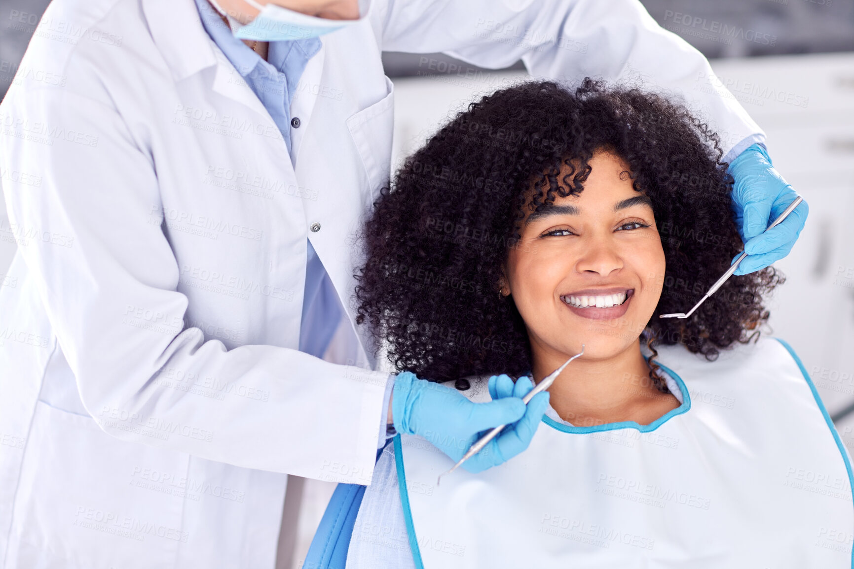 Buy stock photo Shot of a young female patient having her teeth examined at the dentist