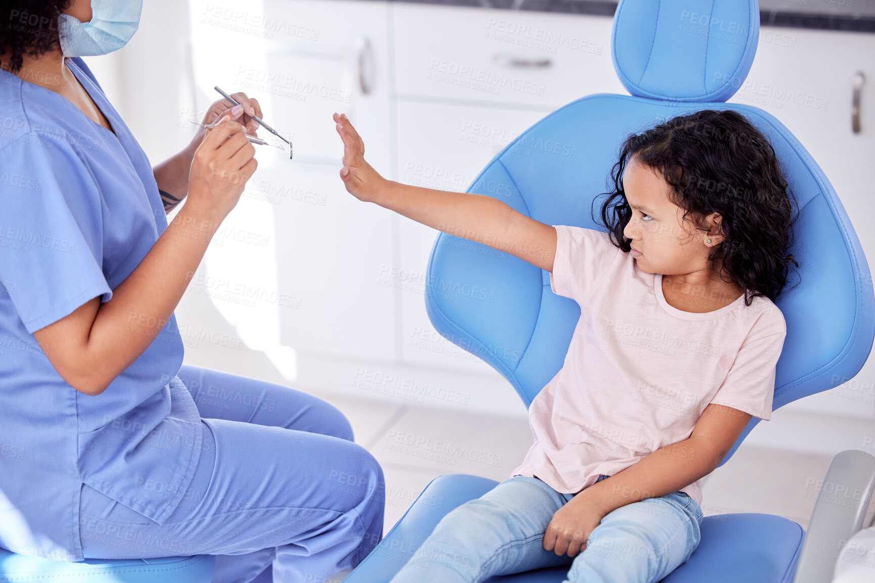 Buy stock photo Stop, scared and dentist with child patient for tooth extraction in clinic with consultation. Fear, dentistry and upset girl kid with pediatric orthodontist for cavity removal with equipment.