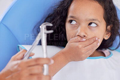 Buy stock photo Shot of a young girl looking scared while having dental work done on her teeth